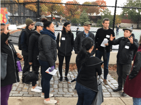 group of people standing during a tour