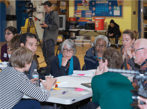 group of people at a table talking