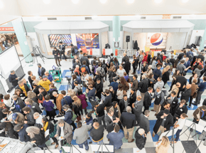Group of people standing in a room 
